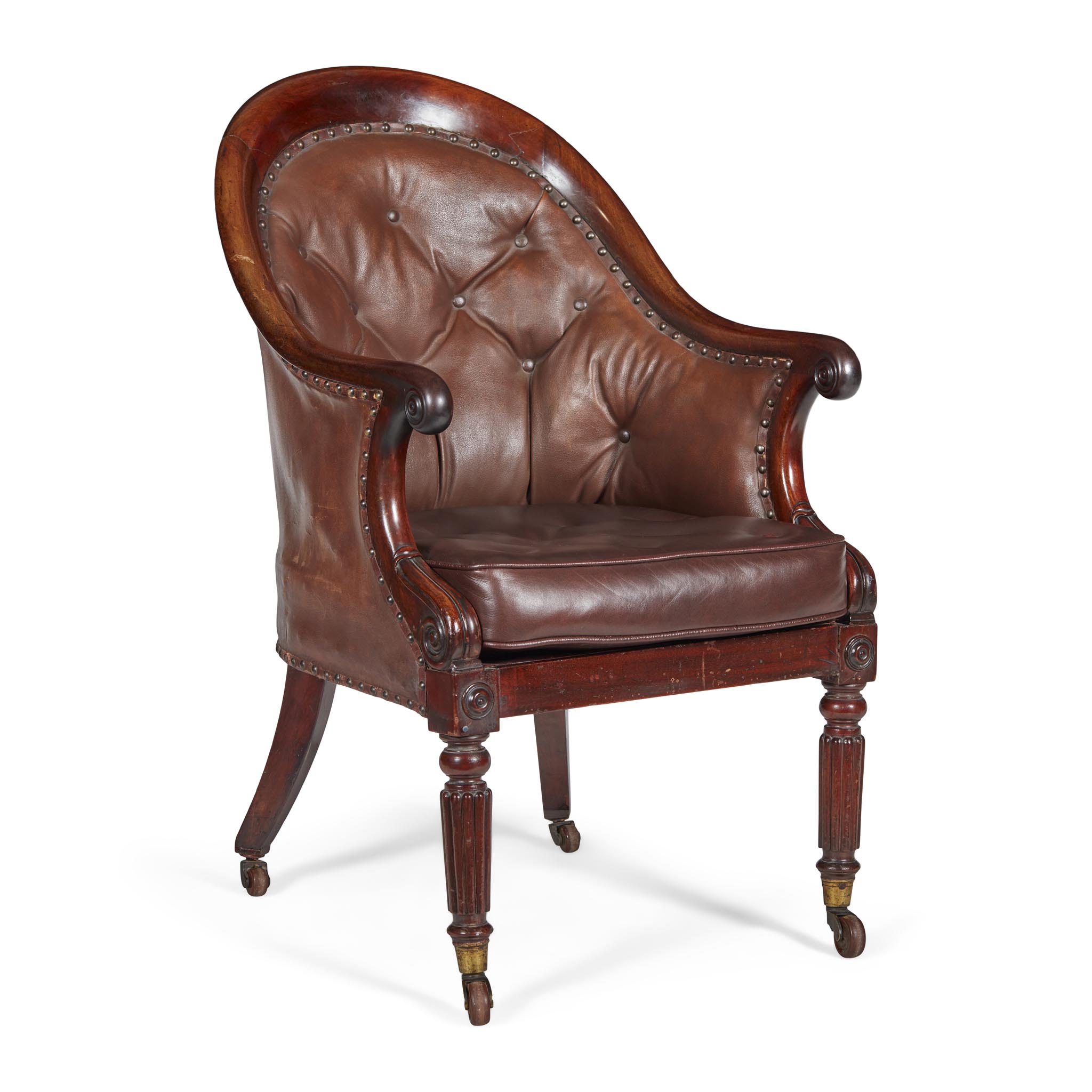 REGENCY MAHOGANY LIBRARY ARMCHAIR, IN THE MANNER OF GILLOWS