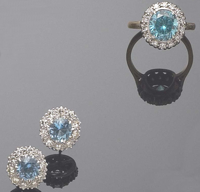 A pair of 18ct white gold mounted aquamarine and diamond earrings,
