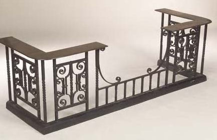 An Arts and Crafts wrought iron club fender,