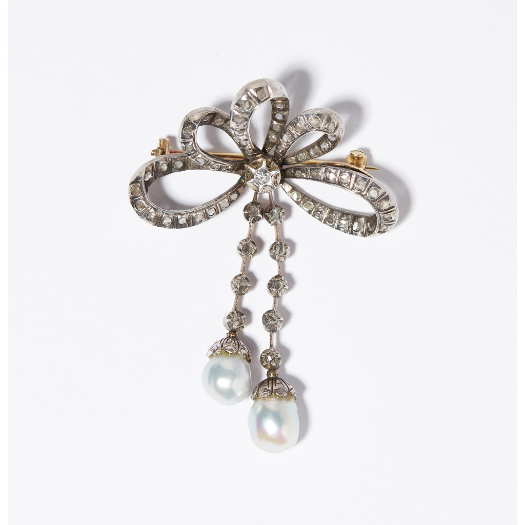 A pearl and diamond set brooch