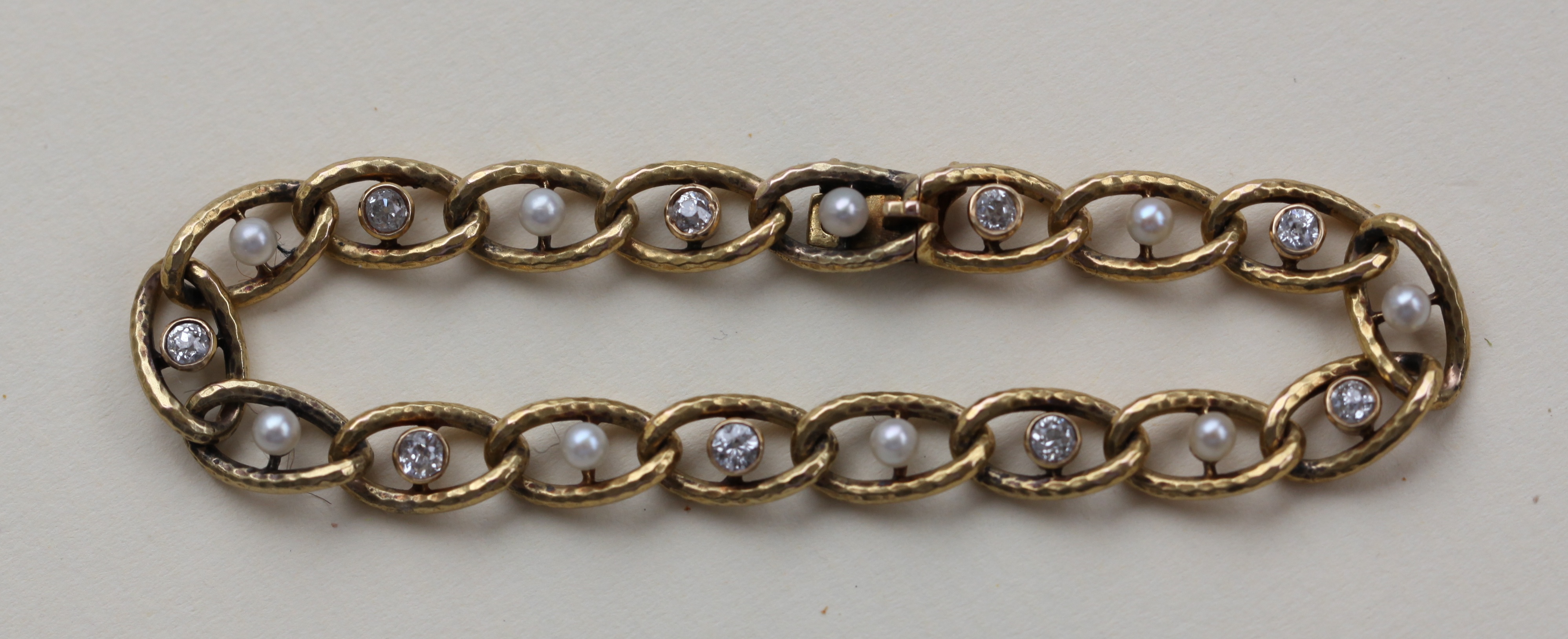 A Edwardian gold pearl and diamond set bracelet