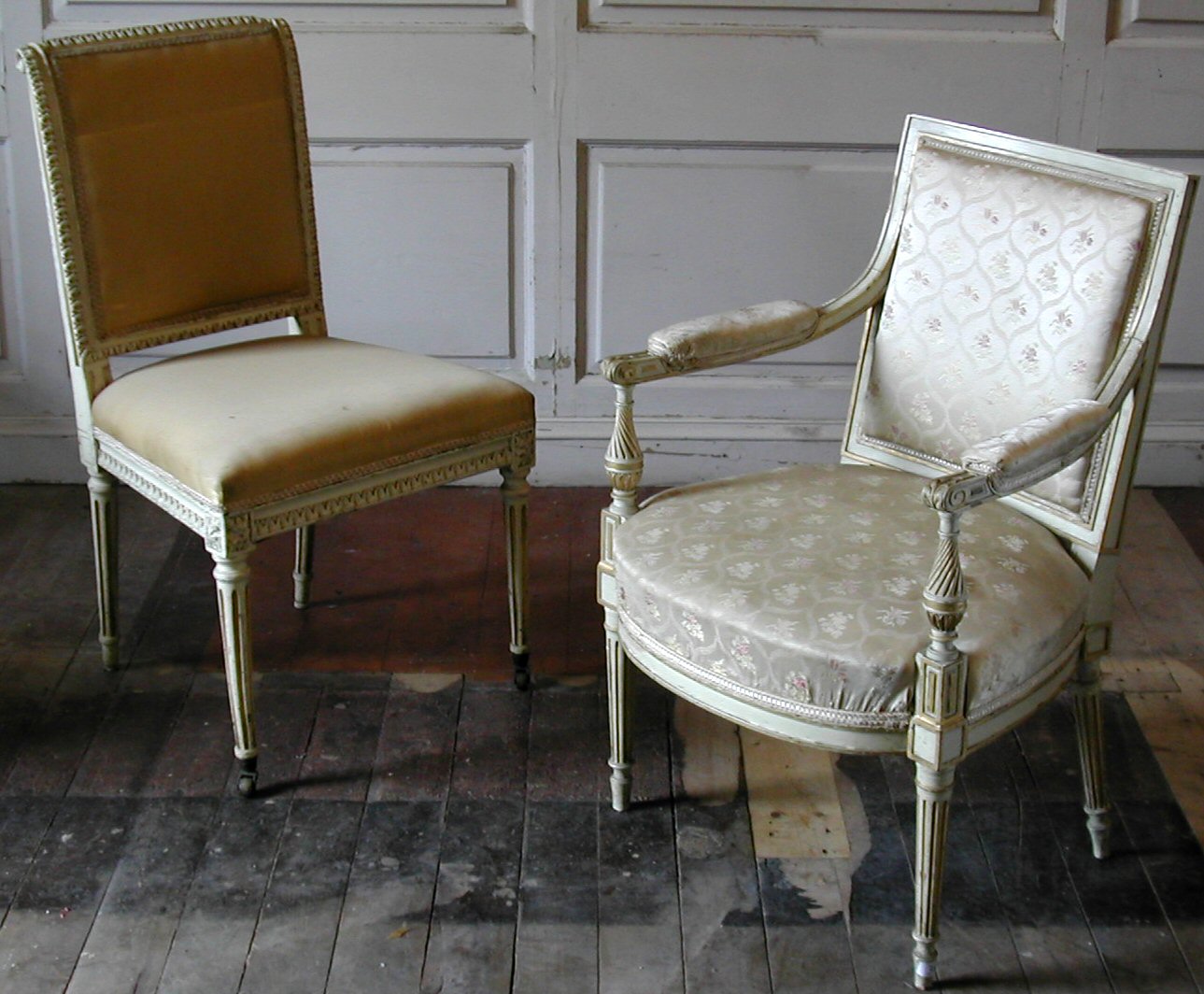 A set of four Louis XVI style overpainted and gilt side chairs,