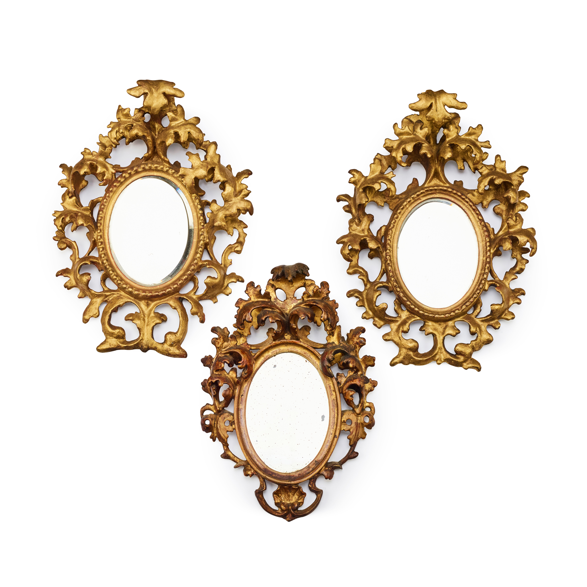 THREE SMALL FLORENTINE OVAL GILTWOOD MIRRORS