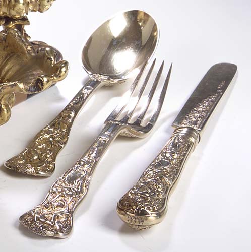 A Victorian composite Bacchanalian pattern gilt dessert set,