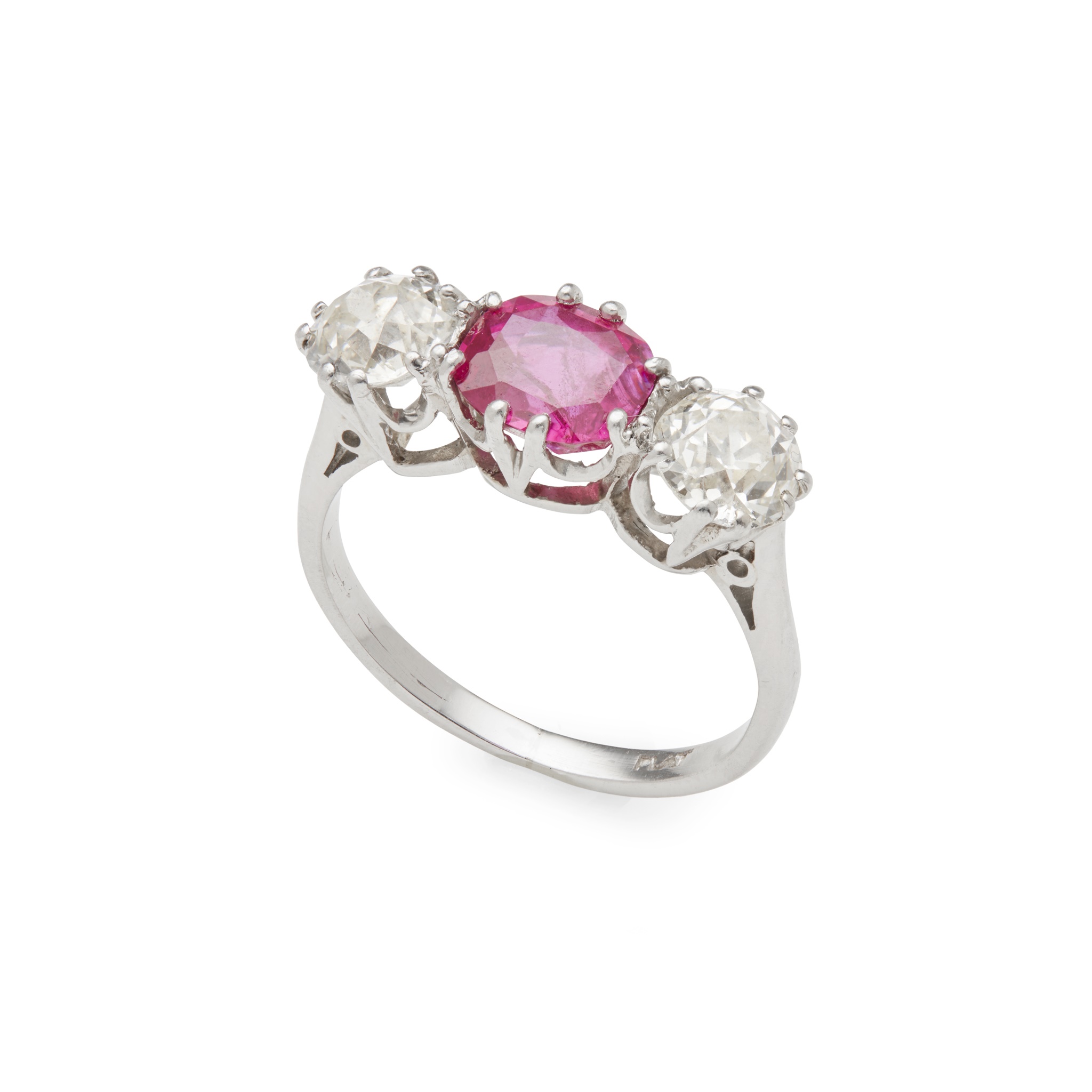 A pink sapphire and diamond three-stone ring