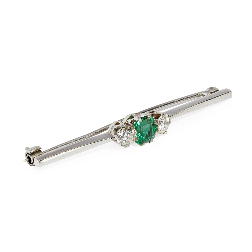 An emerald and diamond set bar brooch