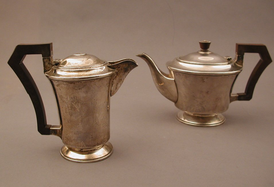 An Art Deco silver teapot and water pot,