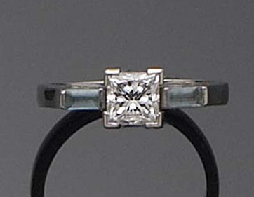 A platinum mounted diamond single stone ring,