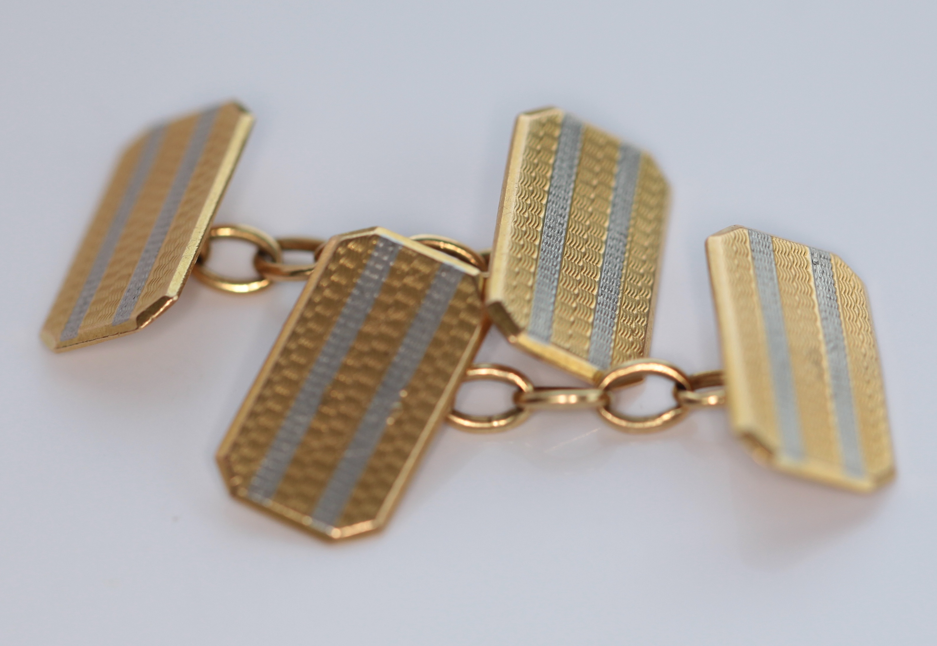 A pair of early 20th century 18ct gold and platinum cufflinks