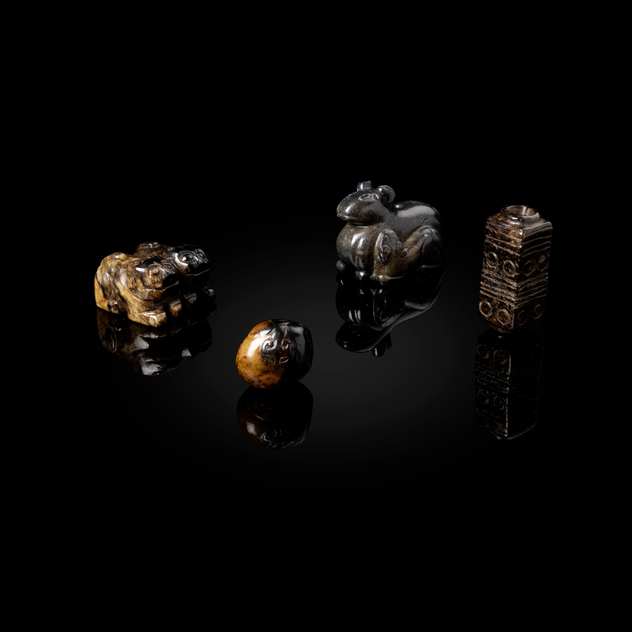 GROUP OF FOUR CHINESE RUSSET JADE CARVINGS