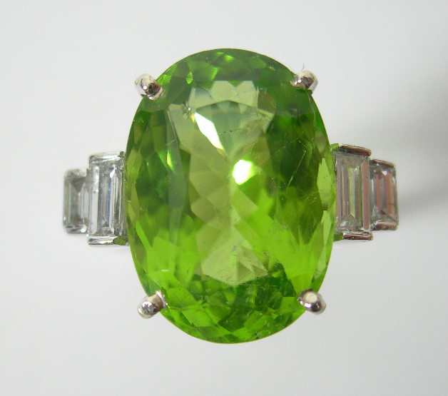 A peridot and diamond set ring,