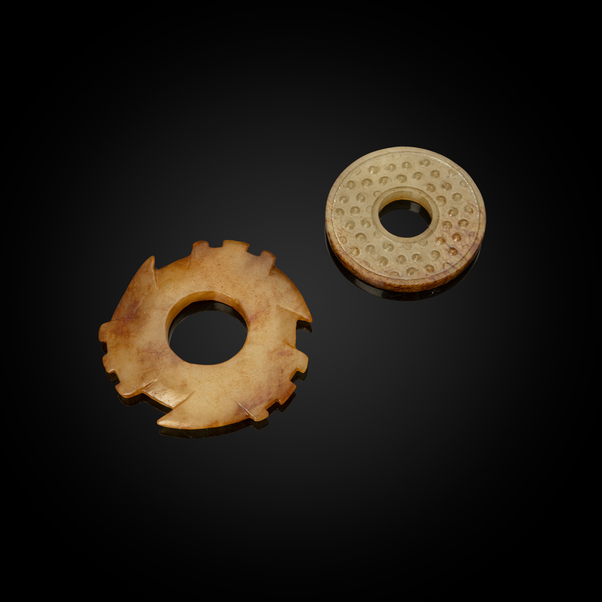 TWO EARLY JADE RINGS