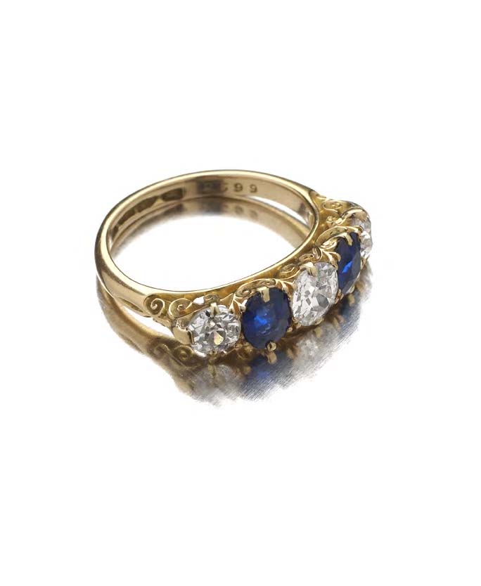 An 18ct gold mounted sapphire and diamond ring,
