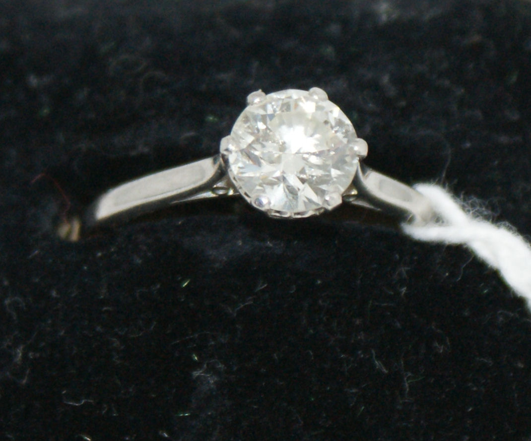 A platinum mounted diamond single-stone ring,