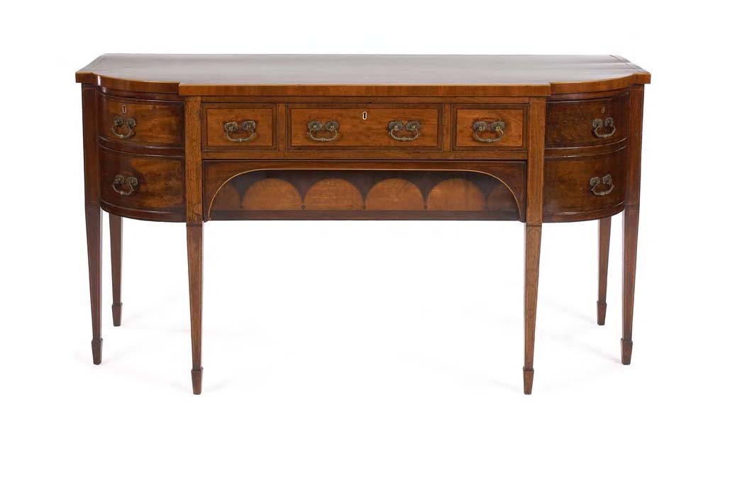 A George III mahogany and boxwood strung sideboard,