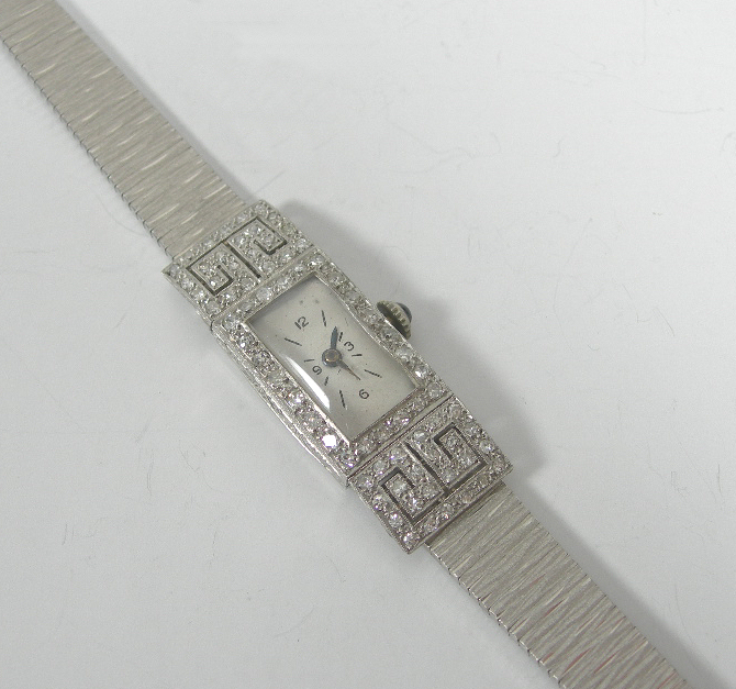 An Art Deco platinum mounted diamond set cocktail watch,