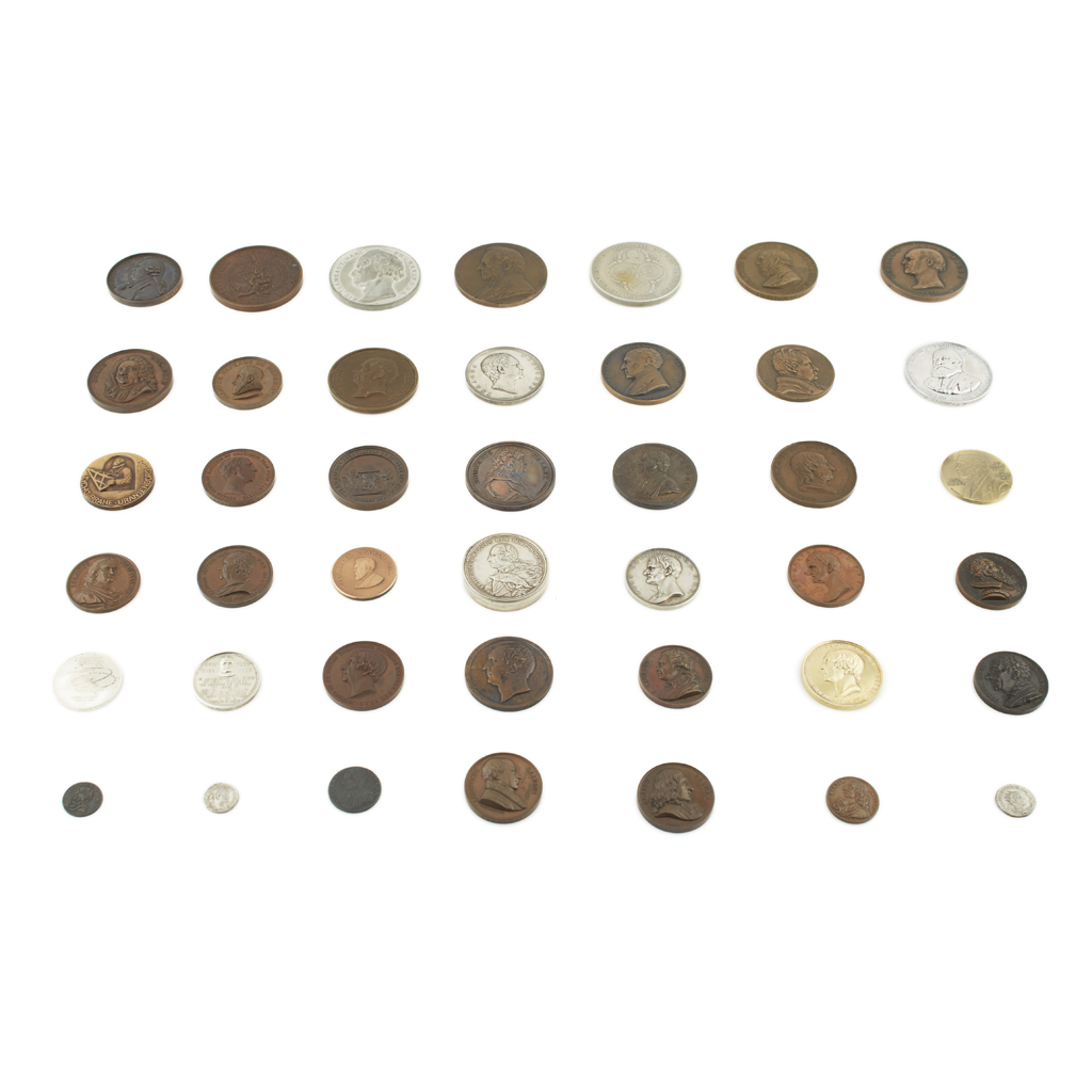 A small late 19th century mahogany collector's cabinet with a collection of Scientific Interest medals