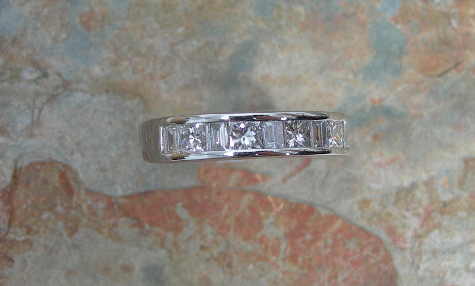 A diamond half-eternity ring,
