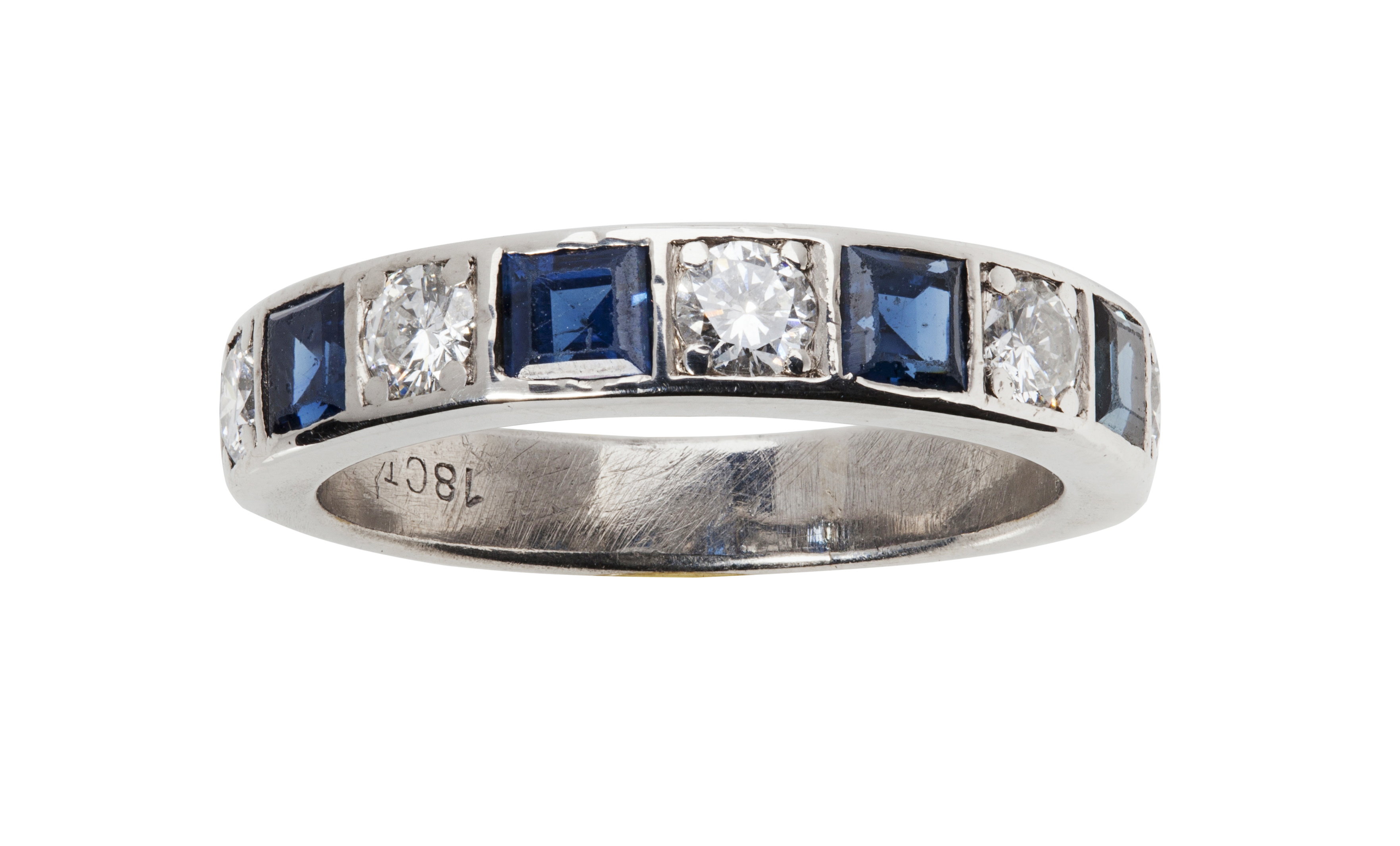 A sapphire and diamond set half eternity ring