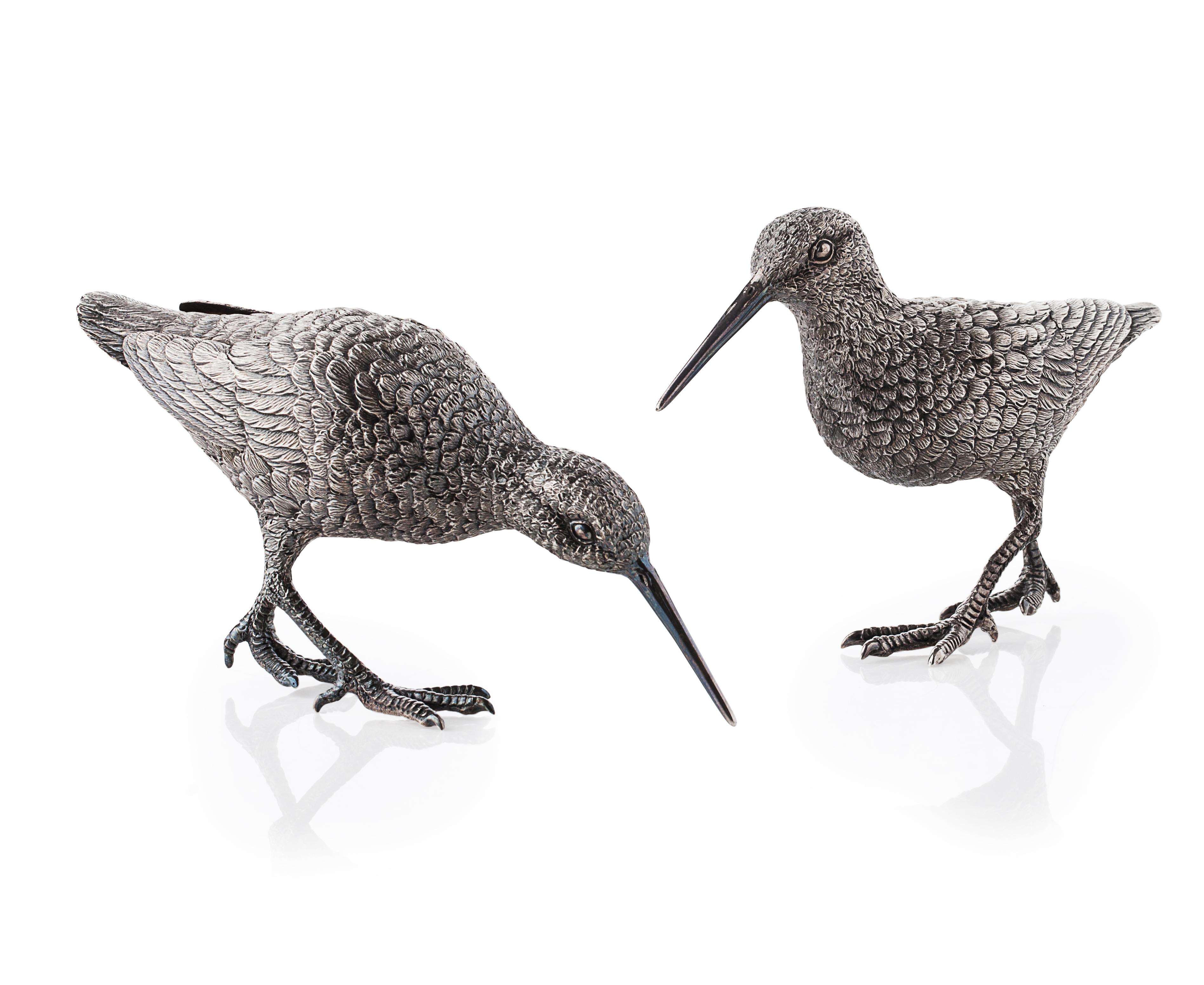 A pair of cast models of snipe