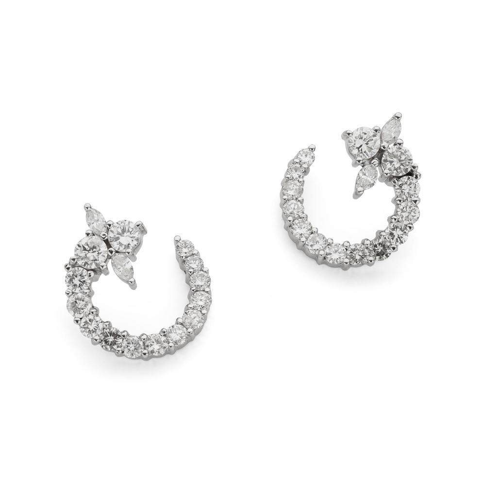 A pair of diamond set earrings
