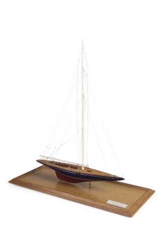 A wood scale model of a yacht,