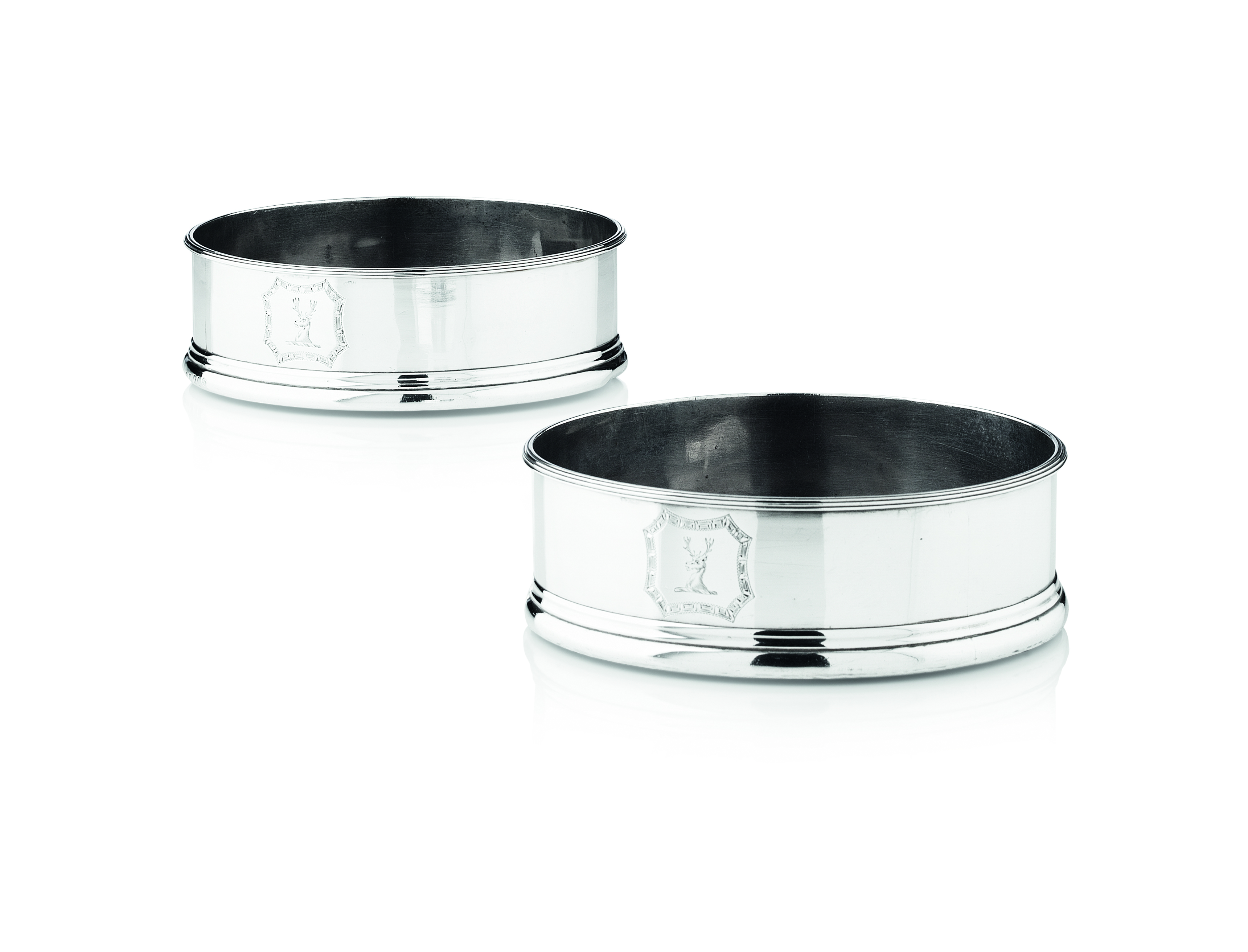 A pair of George III silver wine coasters