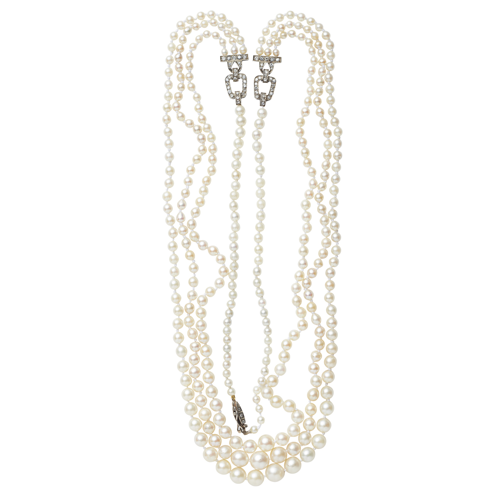 A pearl and diamond set necklace