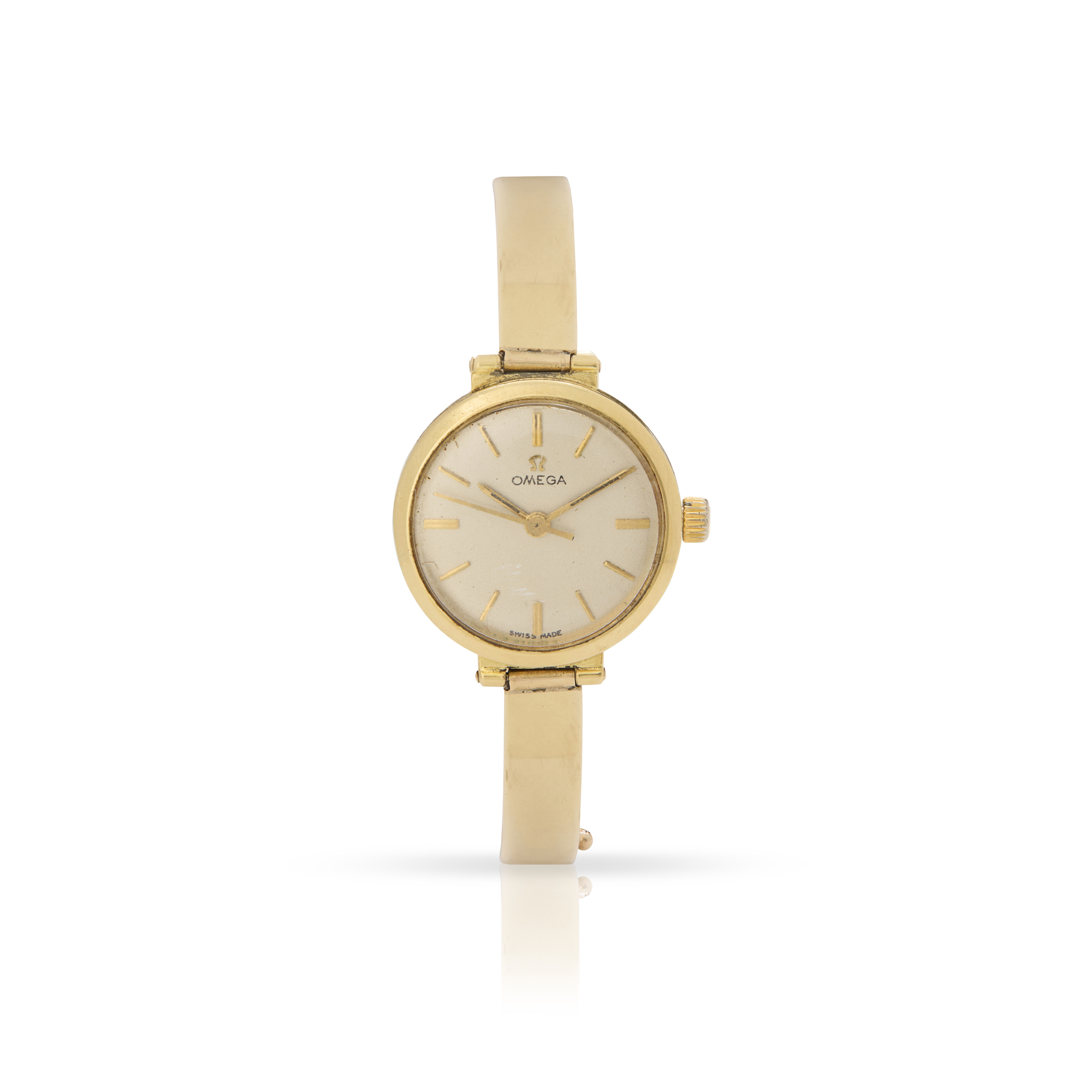 Omega. A Ladies 18k yellow gold wristwatch on associated 9k gold bracelet