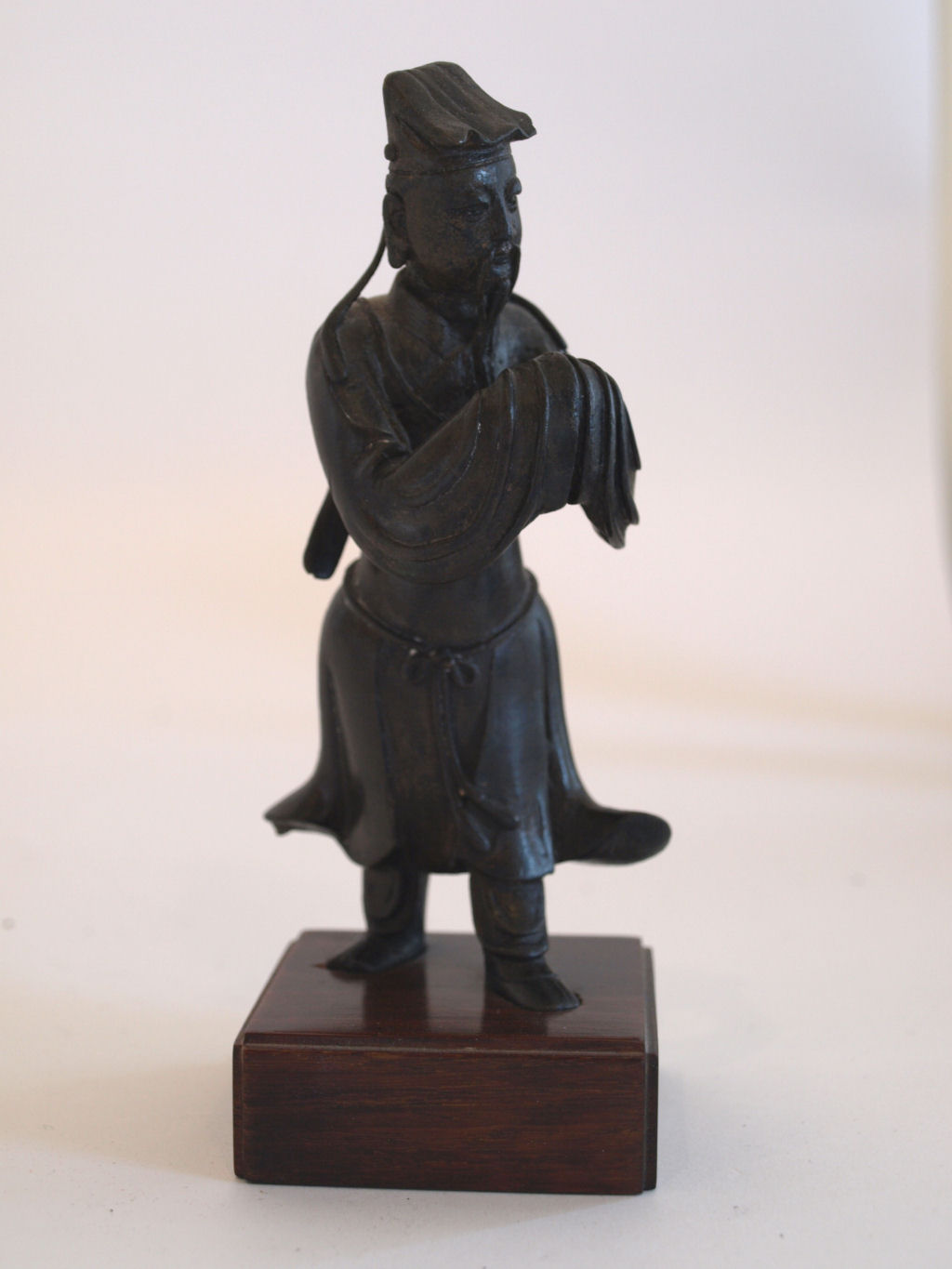 An 18th/19th century Chinese bronze standing figure of a Daoist Immortal
