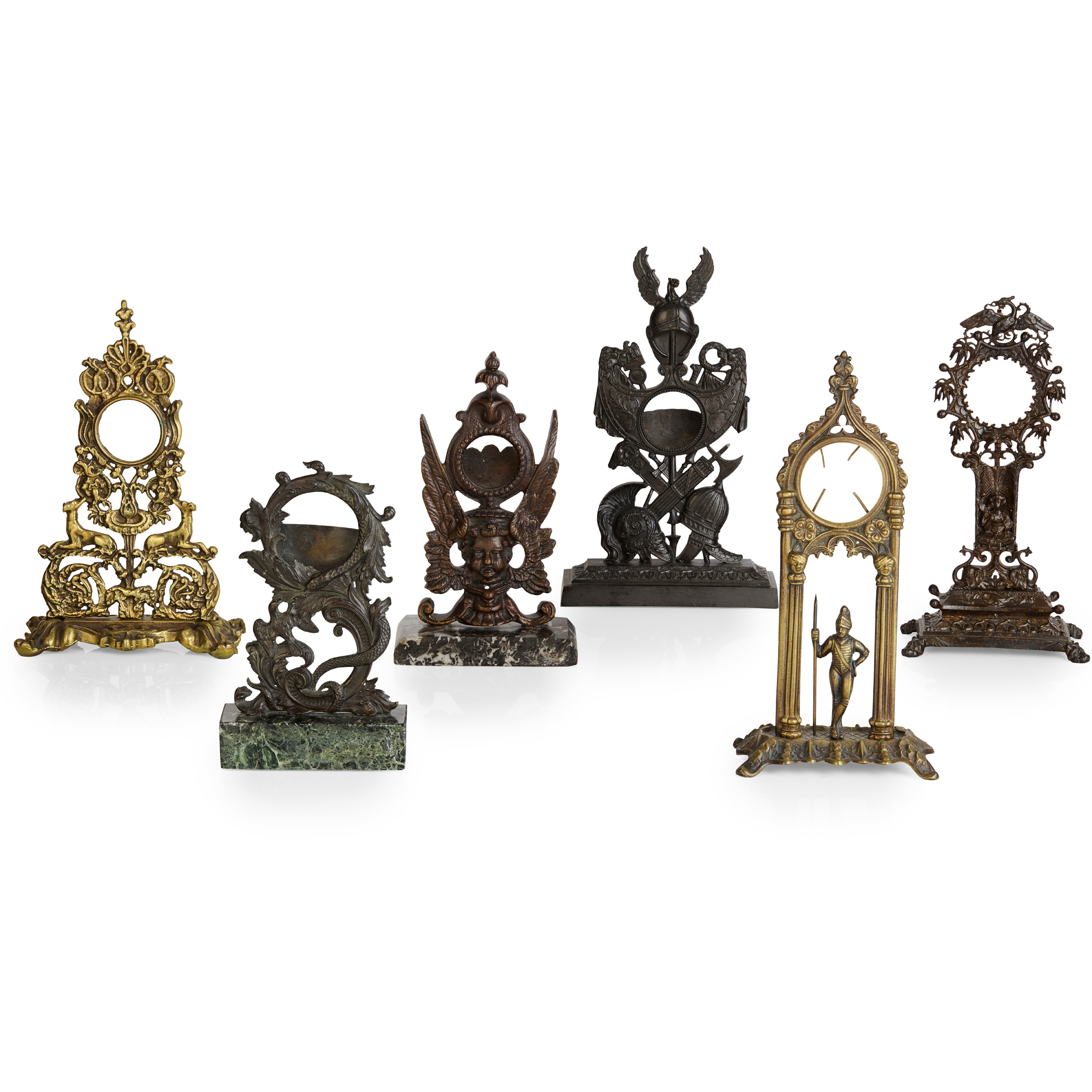 SIX PATINATED METAL OR BRASS POCKET WATCH STANDS