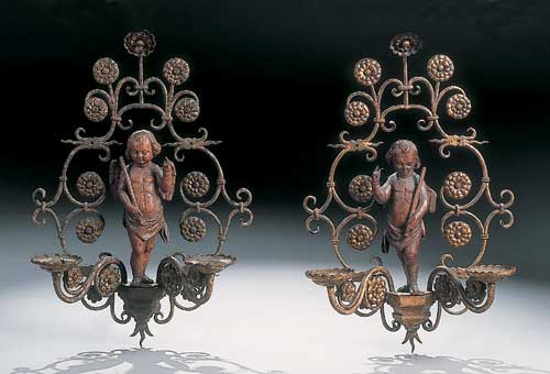 A pair of 18th century French wrought iron wall appliques
