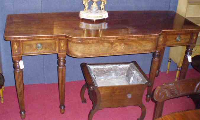 A Regency period mahogany and boxwood strung serving table