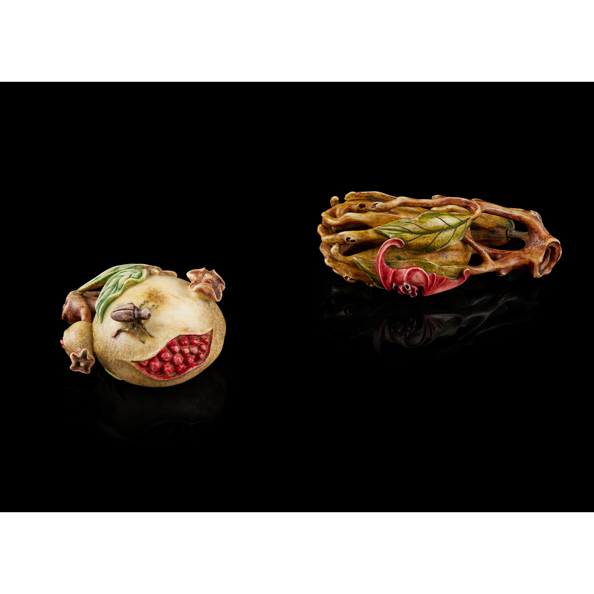 TWO CARVED DEERHORN ORNAMENTS