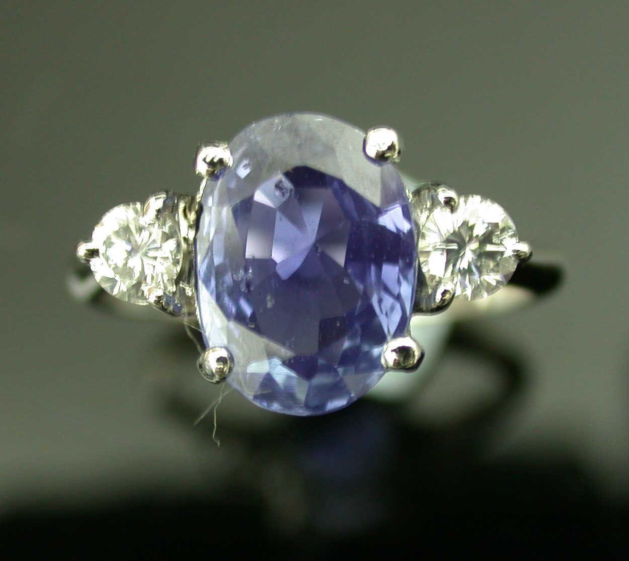 A sapphire and diamond three stone ring,