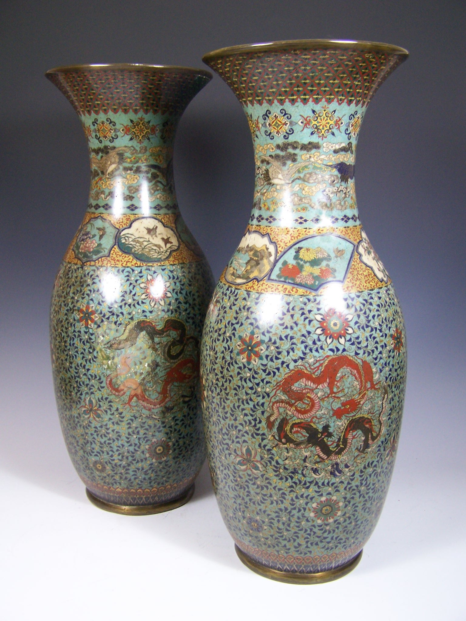 A pair of tall Japanese turquoise ground cloisonne vases
