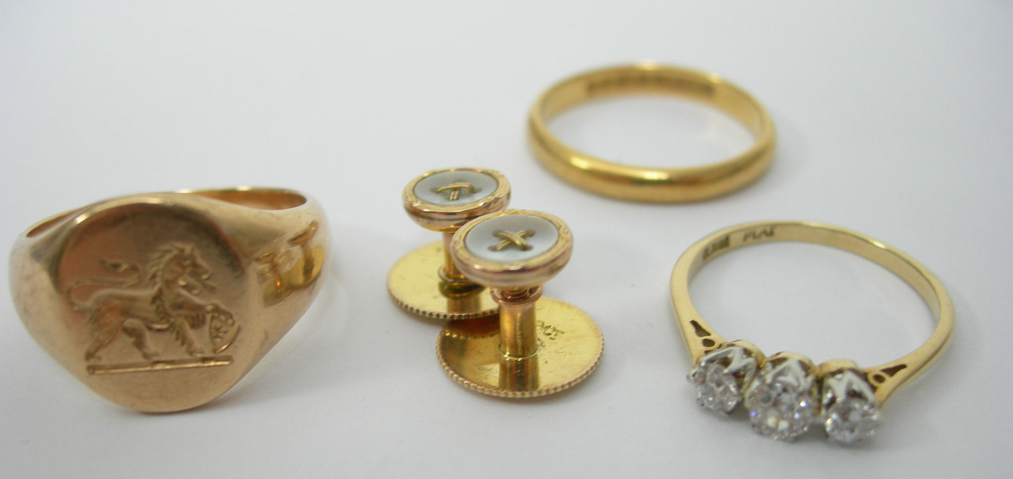 An 18ct gold mounted three-stone diamond ring,