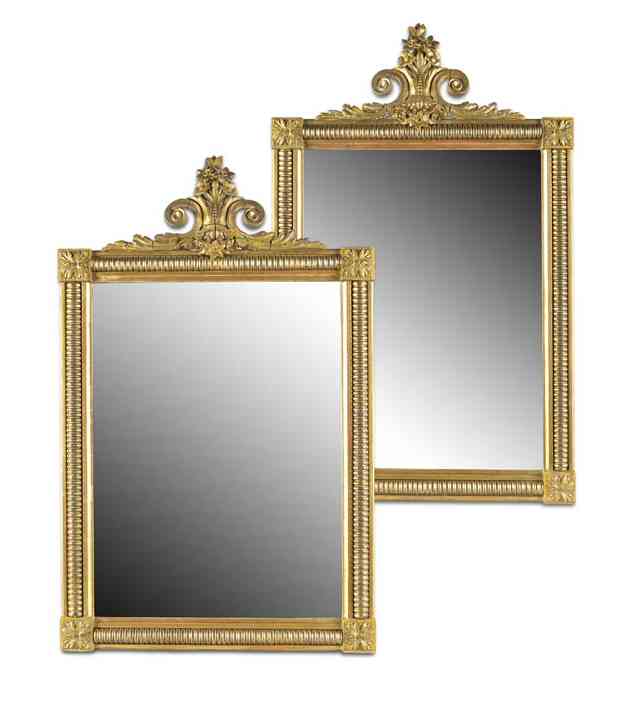 A pair of late George III period giltwood and gesso pier mirrors