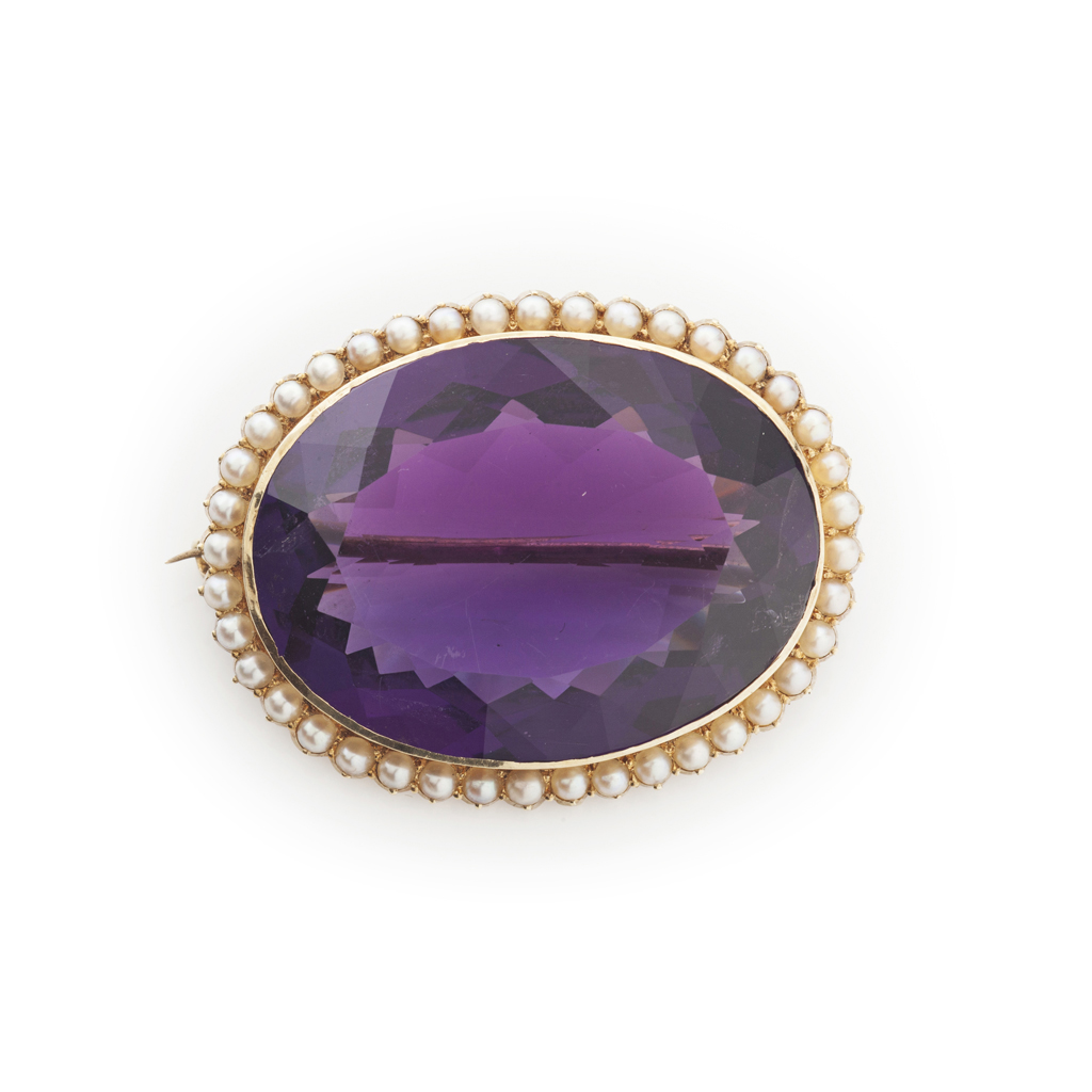 A late Victorian gold mounted amethyst and seed pearl set brooch
