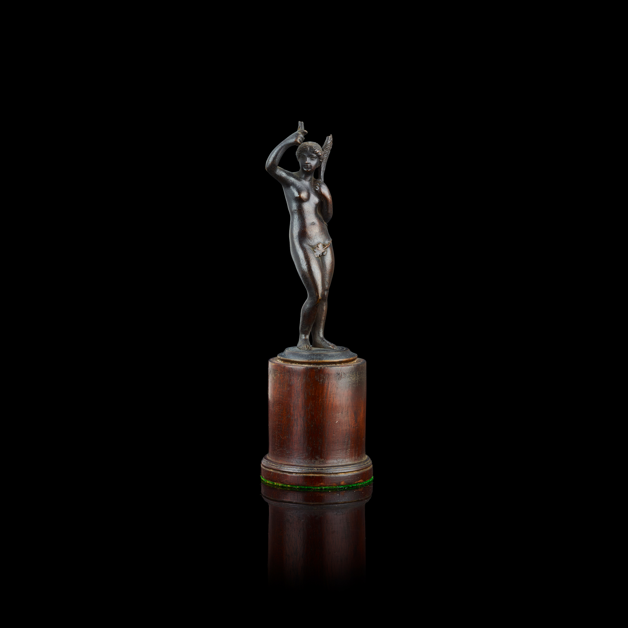 BRONZE FIGURE OF NUDE WOMAN HOLDING A PALM FROND