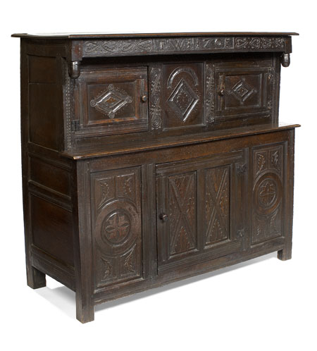 An early 18th century oak court cupboard