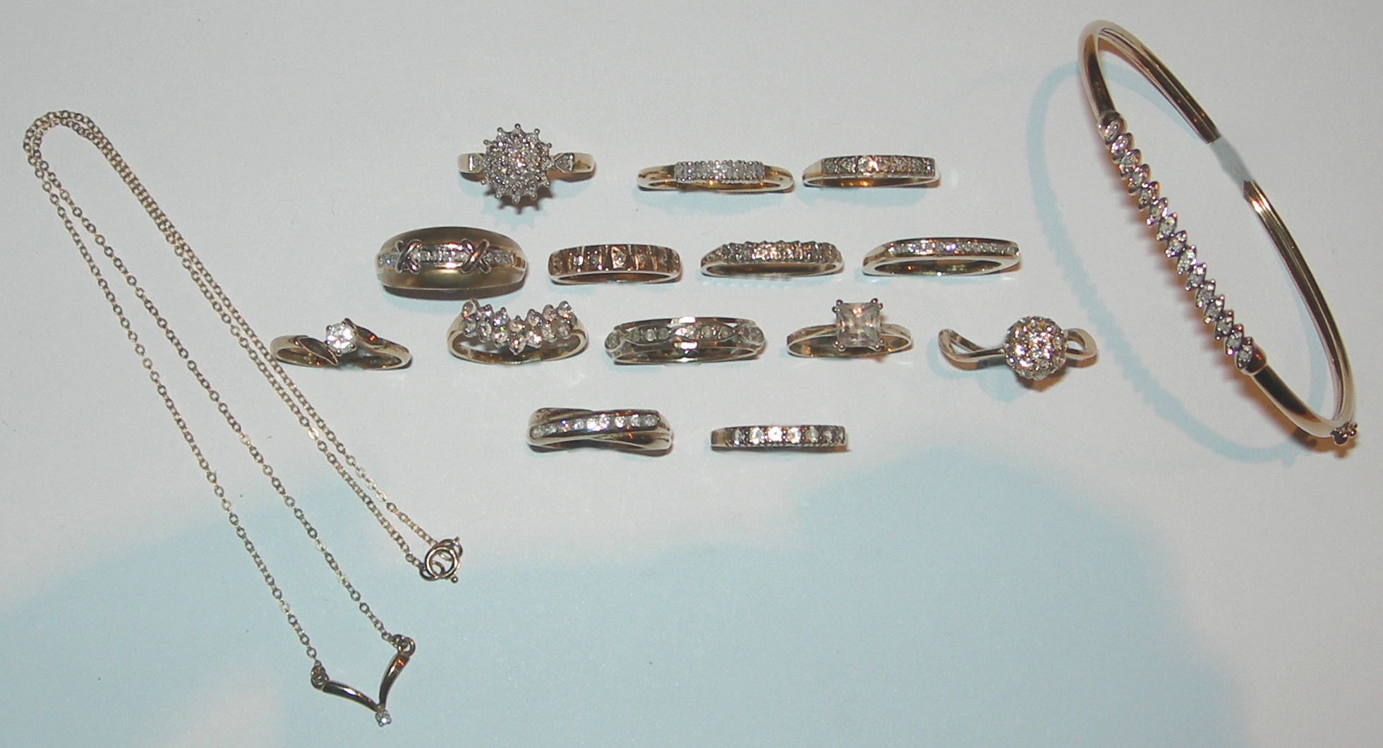 A collection of colourless gem set rings,