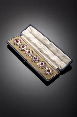 A set of six Guild of Handicraft silver buttons,