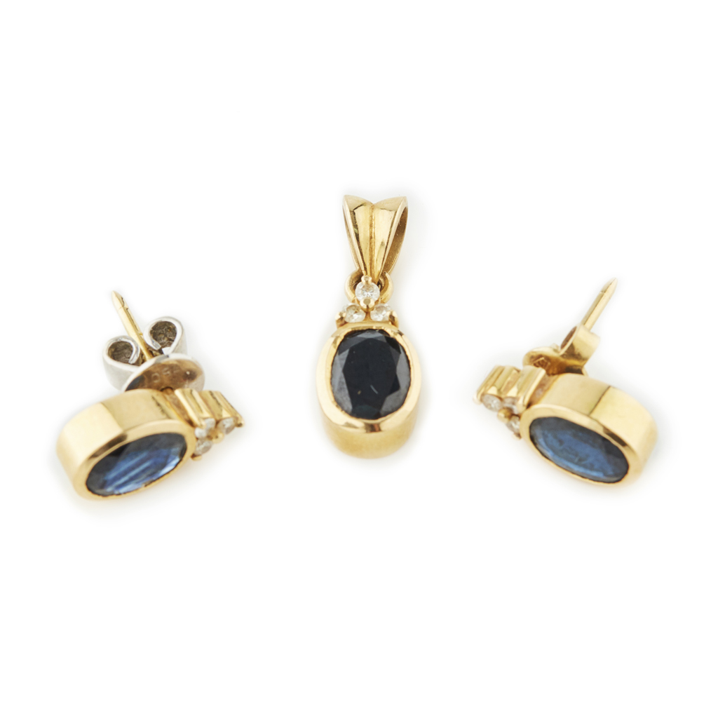 A sapphire and diamond set pendant and matching earrings