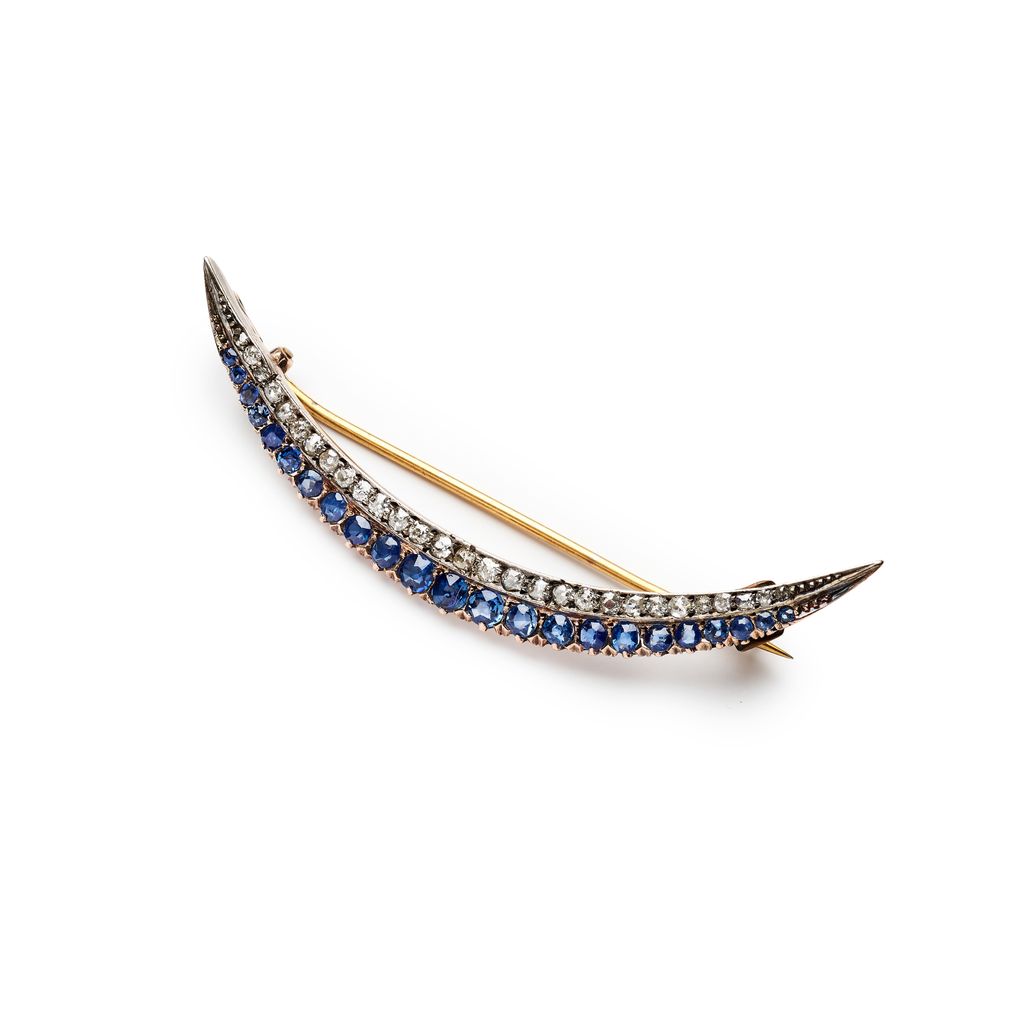 A sapphire and diamond crescent brooch / pendant, circa 1900