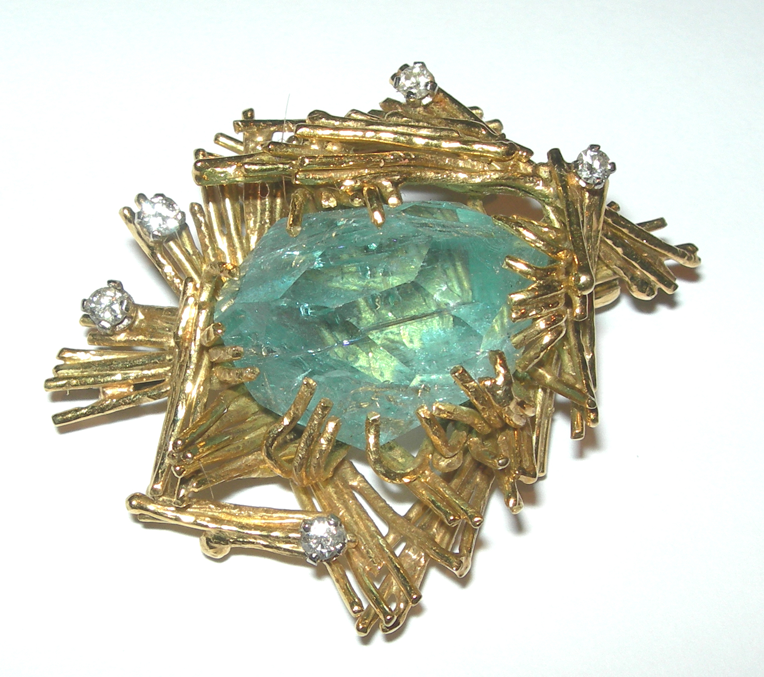 A modern aquamarine and diamond set brooch,