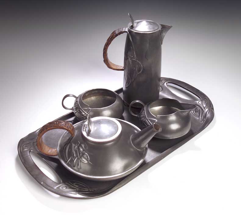 A Tudric pewter tea service designed by Archibald Knox,