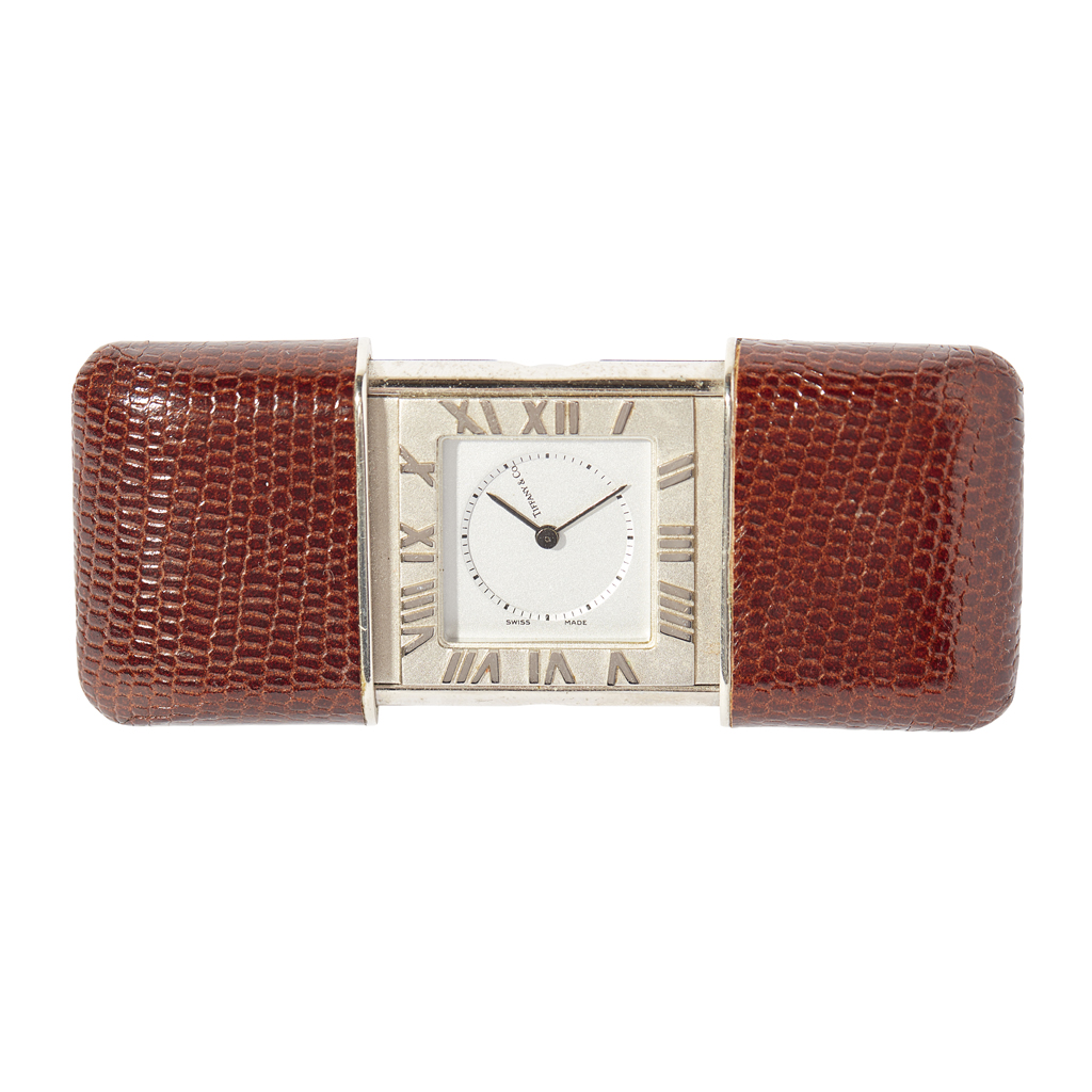 A Tiffany travelling clock with pochette