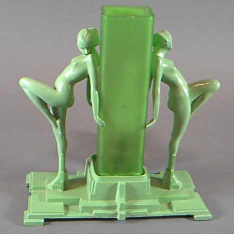 An Art Deco green patinated figural lamp