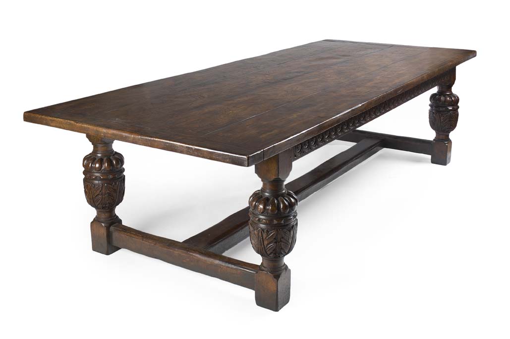 A large 17th century style oak and elm refectory dining table